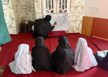 Girls attend a class taught by a woman as many girls in Afghanistan remain denied access to education. (Photo credit: OCHA)