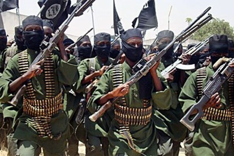 Al-Shabaab fighters raise their weapons during a show of force, as a new UN report says some of the group's members have traveled to Afghanistan. (Photo credit: AP)