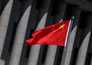 China’s national flag is displayed in front of building columns as Beijing raises concerns over terrorist groups based in Afghanistan. (Photo credit: alarabiya)