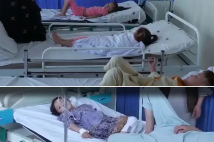Children and adults lie on hospital beds receiving treatment amid a spreading illness in Kabul's Dasht-e-Barchi area. (Photo credit: Exclusive)