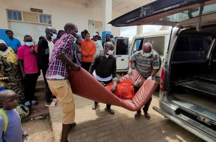 People carry an Ebola patient into an ambulance as health workers respond to the ongoing outbreak in the Democratic Republic of the Congo. (Photo credit: Reuters)
