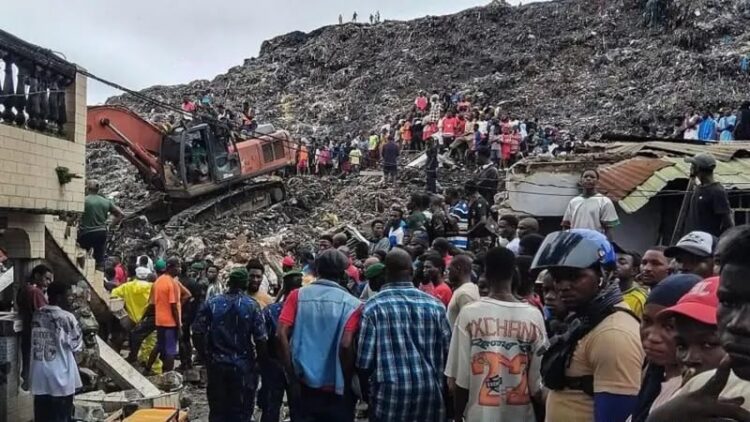 Rescue workers and residents gather at a collapsed landfill in Conakry, Guinea, as excavators clear through piles of waste and debris during search and rescue efforts following the deadly collapse (Photo: AFP)