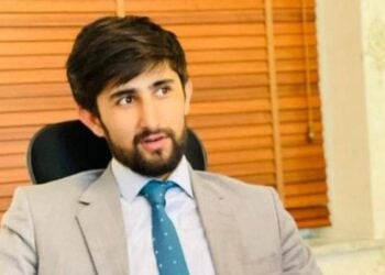 Hamid Farhadi, a journalist detained by the Taliban, pictured in his office. (Photo credit: AFJC)
