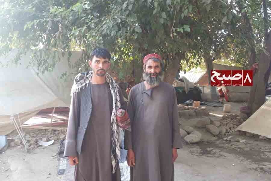 Two Jogi men stand near their tent settlement in Badakhshan province. (Photo credit: 8am.media)