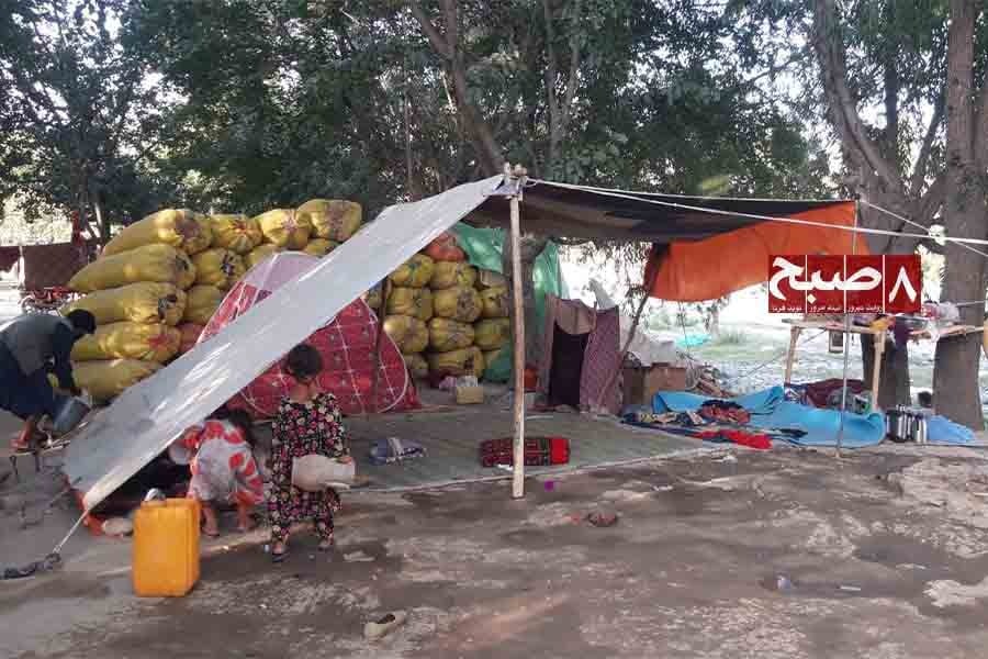 Children gather under a makeshift tent shelter at a Jogi family camp in Badakhshan province. (Photo credit: 8am.media)