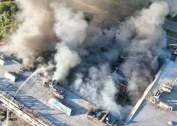 An aerial view shows a large plume of thick smoke rising from a damaged building following the attack (Photo: Dnipropetrovsk ODA)