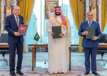 Turkish President Recep Tayyip Erdogan, Saudi Crown Prince Mohammed bin Salman, and Pakistani Prime Minister Shehbaz Sharif pose together after signing the Mecca Pact defense agreement. (Photo credit: Reuters)