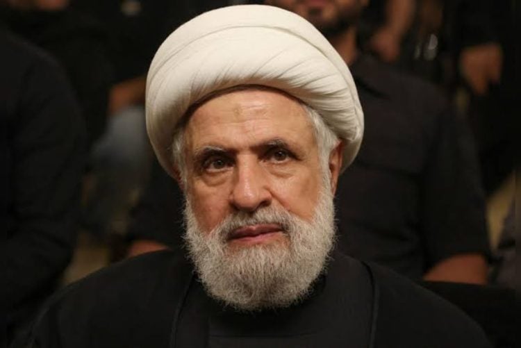 Hezbollah Secretary-General Naim Qassem delivers remarks during a televised speech amid tensions over Lebanon-Israel negotiations. (Photo credit: Reuters)