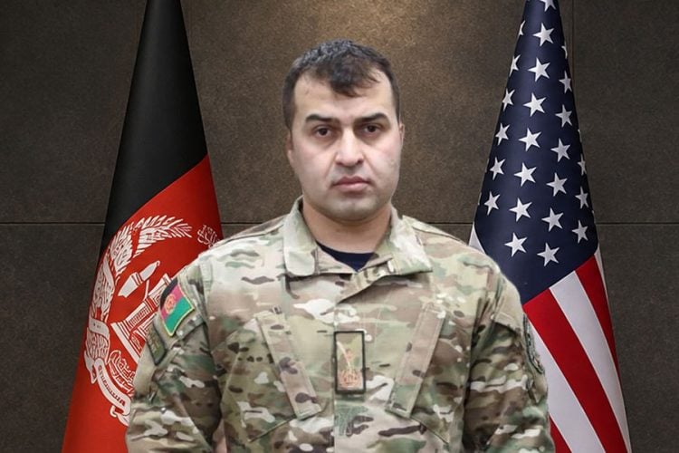 Sami Sadat, leader of Afghanistan United Front, stands in military uniform between the Afghan and American flags. (Photo credit: Social Media)