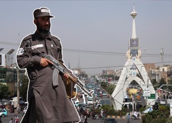 An armed Taliban fighter stands guard near a public square in Herat city amid heightened security and movement restrictions. (Photo credit: AFP)