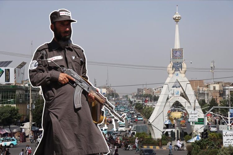 An armed Taliban fighter stands guard near a public square in Herat city amid heightened security and movement restrictions. (Photo credit: AFP)