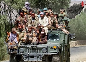 Armed Taliban fighters ride atop a military Humvee in Afghanistan, as clashes erupt with a dissident commander's forces in Badakhshan's Nusay district. (Photo credit: AFP)