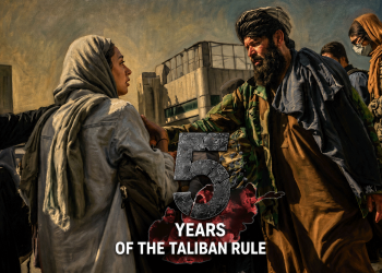A woman speaks with a Taliban fighter as armed members and displaced people gather nearby, marking five years of Taliban rule in Afghanistan. (Photo credit: AFP)