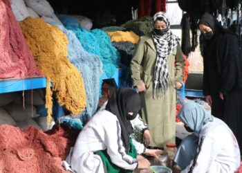 Women work at a carpet workshop in Afghanistan as women’s participation in economic activity continues to decline. (Photo credit: @ILOAfghanistan)
