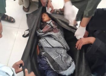 The body of a 12-year-old child killed by armed robbers in Badghis province. (Photo credit: Exclusive)