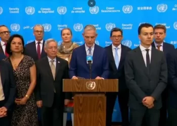 Diplomats stand together during a United Nations meeting as 43 countries call for the removal of restrictions on women and girls. (Photo credit: @franceonu)