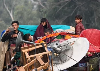 Afghan migrants traveling with their belongings after being deported (Photo: AFP)