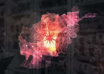 A symbolic map of Afghanistan surrounded by cancer cells, highlighting concerns over rising cancer cases and limited treatment services. (Photo credit: Magnific)