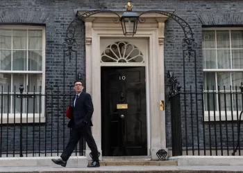 A man walks past 10 Downing Street, the official residence and office of the British prime minister, in London (Photo: Reuters)