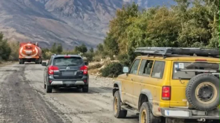 Vehicles travel along a mountainous road in Badakhshan, Afghanistan, with a fuel tanker and other cars navigating the rural route (Photo: Exclusive)