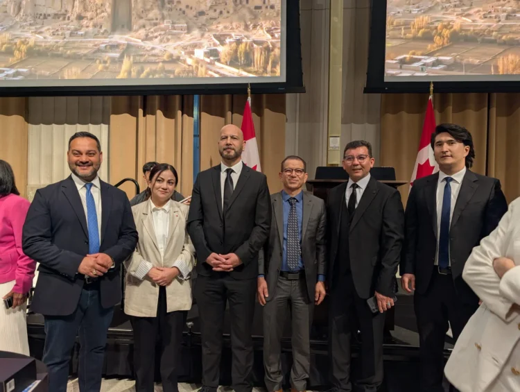 Officials and participants pose for a photo during a memorial ceremony for victims of the Hazara genocide held in the Canadian Parliament (Photo: Exclusive)