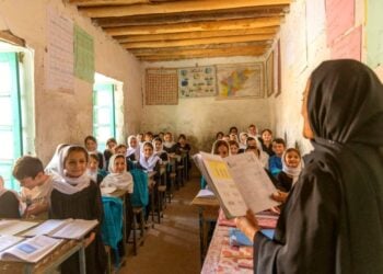 A teacher is teaching at a school in Afghanistan, while female students listen to the lesson. (Photo: UNICEF)