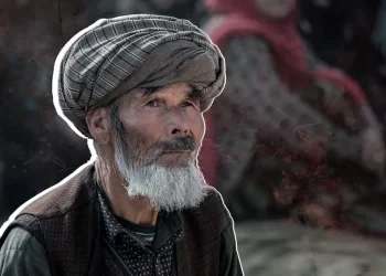 An elderly man from Afghanistan looks on, as many families across the country rely on remittances from relatives abroad to survive worsening poverty. (Photo credit: AFP)