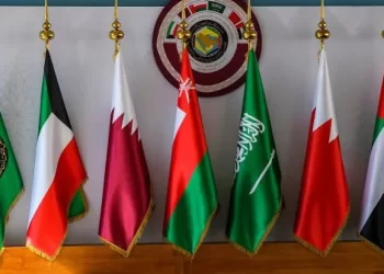 Flags of Gulf Cooperation Council member states are displayed beneath the organization’s emblem (Photo: Aljazeera)