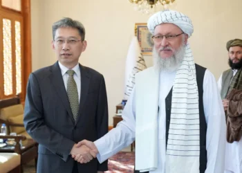 Abdul Salam Hanafi shakes hands with Chinese Ambassador Zhao Xing during a farewell meeting in Kabul. (Photo credit: @FitratHamd)