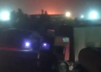 The fire has been extinguished, with emergency crews working at the scene as the area remains illuminated at night (Photo: Exclusive)