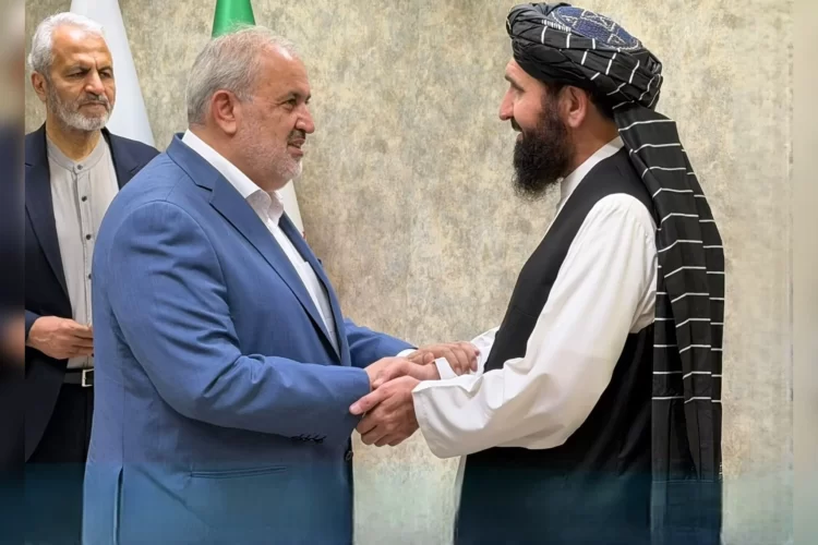Iranian Energy Minister Abbas Aliabadi and Taliban official Ahmad Jan Bilal shake hands during a meeting on energy cooperation. (Photo credit: @GDSOCorps)