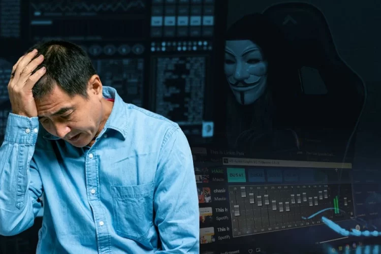 A distressed man holds his head as a masked hacker and audio-editing software loom in the background, symbolizing the rise of AI-driven online scams. (Photo credit: Pexels)