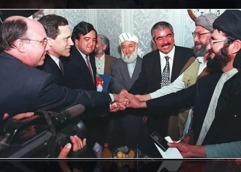 Leaders and officials of Afghanistan's anti-Taliban Northern Alliance shake hands with foreign representatives during a meeting in the late 1990s. (Photo credit: Getty Images)