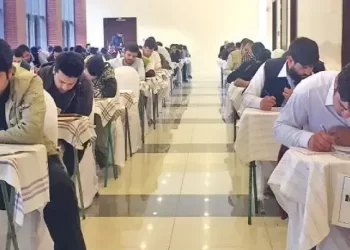 Afghan students taking an exam in Pakistan. (Photo: DAWN)