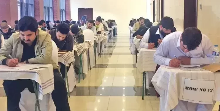 Afghan students taking an exam in Pakistan. (Photo: DAWN)