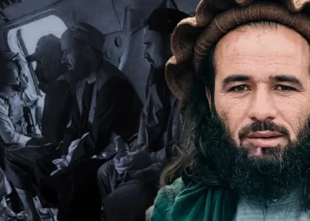 A Taliban commander is pictured against an archival image of fighters riding in a helicopter, as the group cracks down on forces once loyal to Jumakhan Fateh. (Photo credit: social media)