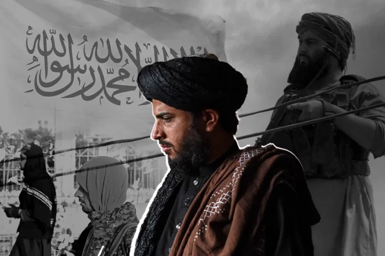 Armed Taliban members stand beneath the Taliban flag amid tensions over US-Taliban relations. (Photo credit: AFP)
