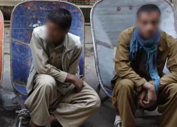 Two young men sit with faces obscured as rising unemployment forces many young people in Afghanistan to give up their hopes for the future. (Photo credit: Social Media)