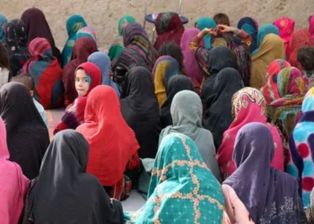 A group of young Afghan girls sitting in rows (Photo: Getty Images)