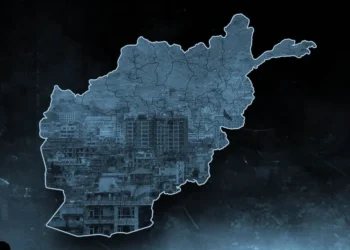 A map of Afghanistan overlaid with a dense cityscape reflects the debate over the country’s political system and economic development. (Photo credit: Pexels)