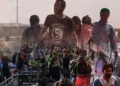 A composite image shows a crowd of people pushing carts along a road, overlaid with portraits of men and a child, reflecting migration from Afghanistan. (Photo credit: AFP)