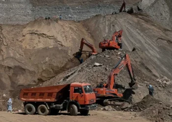 Excavators and a dump truck work at an open-pit mine site in Badakhshan as gold miners say official mining has been halted for two months. (Photo Credit: AFP)