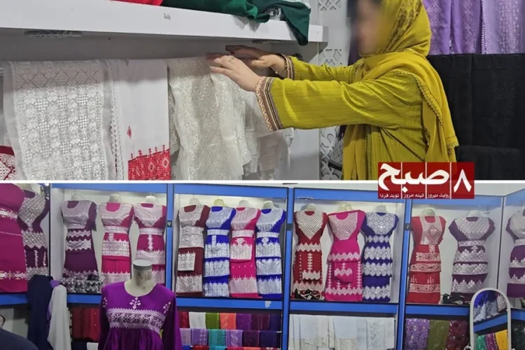 A woman looks through embroidered dresses and fabrics at a clothing shop in Afghanistan as families struggle with rising dowry costs. (Photo credit: 8am.media)