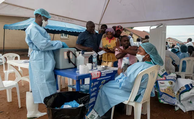 Healthcare workers wearing protective equipment assist patients at an Ebola treatment and screening center in the Democratic Republic of Congo (Photo: Reuters)