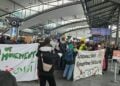Demonstrators hold banners in German during a protest against the forced deportation of asylum seekers in Germany. (Photo credit: Exclusive)