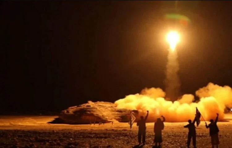 A ballistic missile is launched as people gather nearby amid escalating tensions involving the Houthis and Saudi Arabia. (Photo credit: IRNA)