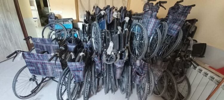 A collection of wheelchairs stored indoors, ready for distribution to people with mobility difficulties (Photo: @MoPH_afg)