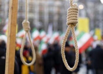 A noose hangs in the foreground during a public gathering in Iran, symbolizing the country’s use of capital punishment (Photo: DPA/PA)