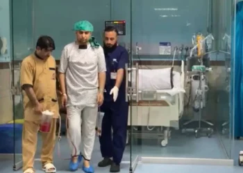 Healthcare workers stand beside a patient’s bed in a hospital ward amid new Taliban restrictions on medical procedures in Kandahar. (Photo credit: Exclusive)