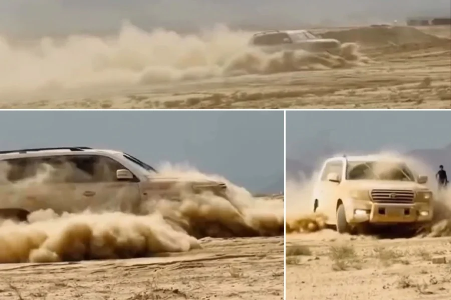 Social media videos show an SUV driving at speed across a sandy desert, kicking up large clouds of dust. (Photo credit: social media)